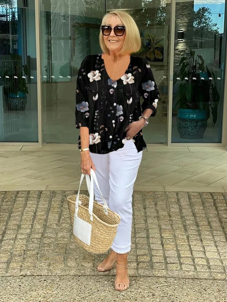 Blommönstrad blus dam med V-ringning