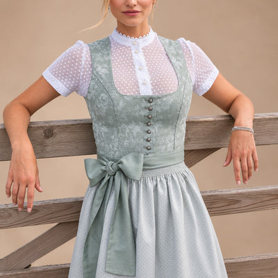 Dirndl dam med rosett — klassisk Oktoberfest-klänning