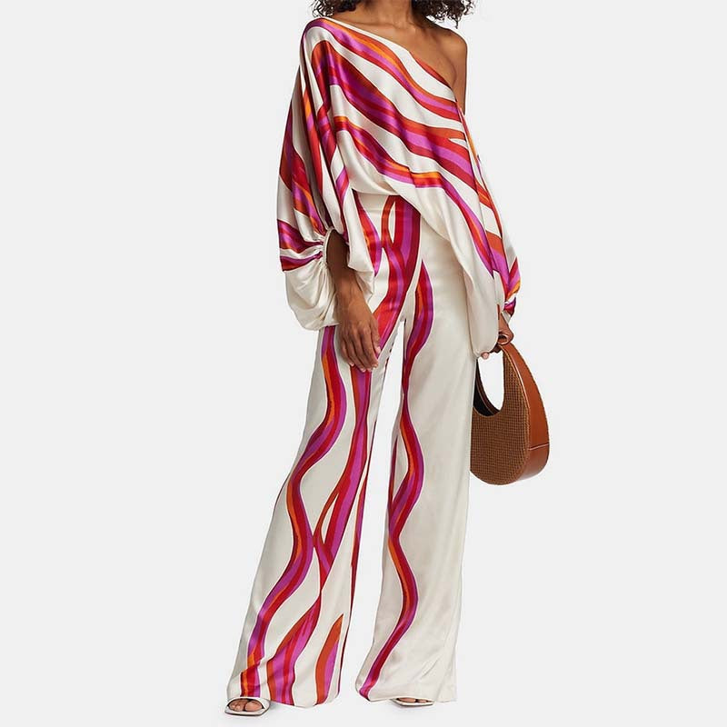 Tvådelat set dam med off-shoulder topp och vida byxor