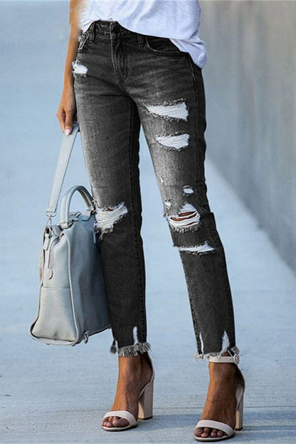 Rippade raka damjeans i denim — distressed jeans med rå fåll