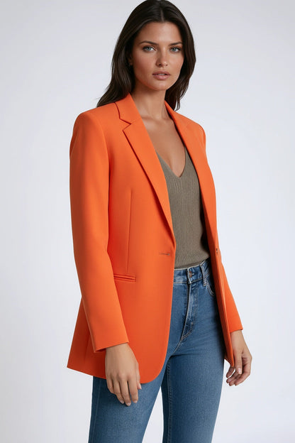 Långlinjad blazer dam i orange – figursydd statementblazer