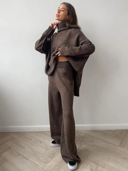 Klassiskt enfärgat set dam med stickad tröja och vida byxor